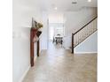 Bright and spacious entryway with tile flooring and a view to the dining area at 8622 Dufferin Ln, Orlando, FL 32832