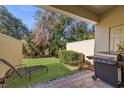 Small backyard with grassy area and privacy wall at 8167 Roseville Rd, Davenport, FL 33896