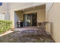 Private patio with lounge chair and gas grill at 8167 Roseville Rd, Davenport, FL 33896