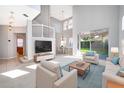 Bright living room with high ceilings and lots of natural light with view to dining room and backyard at 11313 Via Andiamo, Windermere, FL 34786