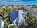 Charming home exterior featuring a metal roof and well-maintained landscaping at 6353 River Rd, New Smyrna Beach, FL 32169