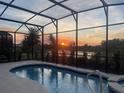 Relaxing screened pool area with sunset views at 7833 Oak Reflection Loop, Davenport, FL 33837