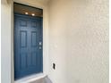 Modern dark blue front door with a glass window above at 791 Chinoy Rd, Davenport, FL 33837