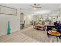 Bright living room features modern furnishings, decorative wall art, and a stylish ceiling fan at 320 Lakeview St # 123, Orlando, FL 32804