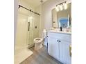 Modern bathroom with a glass shower and white vanity at 3602 Calabria Ave, Davenport, FL 33897