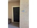 A dark front door with unit number and traditional hardware at 5542 Metrowest Blvd # 206, Orlando, FL 32811