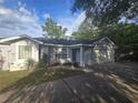 Charming single-story home featuring manicured landscaping and an attached two car garage at 713 Swan Way, Kissimmee, FL 34758