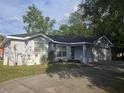 Charming single-story home featuring manicured landscaping and an attached two car garage at 713 Swan Way, Kissimmee, FL 34758