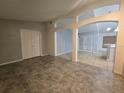 Spacious living room with tile flooring and neutral walls at 713 Swan Way, Kissimmee, FL 34758