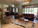 Cozy living room with neutral walls, ceiling fan, an area rug, and plenty of seating at 2355 Abalone Blvd, Orlando, FL 32833