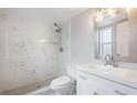 Modern bathroom with white marble shower and updated fixtures at 1000 S Semoran Blvd # 814, Winter Park, FL 32792