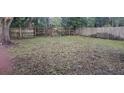 Large backyard with a wooden fence at 1859 Lake Hill Cir, Orlando, FL 32818