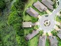 Aerial view of the house, showcasing lush backyard landscaping, proximity to water, and neighborhood at 513 San Sebastian Ct, Davenport, FL 33837