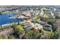 Aerial view showcasing the property's location near a lake and community amenities at 513 San Sebastian Ct, Davenport, FL 33837