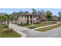Charming two-story brick home with manicured lawn and welcoming curb appeal at 465 Songbird Way, Apopka, FL 32712