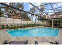 Spacious screened pool with surrounding patio at 465 Songbird Way, Apopka, FL 32712