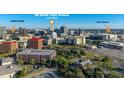 Drone view of a city, highlighting a building's location and proximity to landmarks at 155 S Court Ave # 2908, Orlando, FL 32801