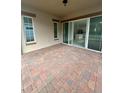 Spacious covered patio with brick pavers at 2335 Datura Loop, Saint Cloud, FL 34772
