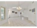 Bright dining room featuring tile floors and a chandelier at 250 Silas Phelps Ct, Orlando, FL 32828
