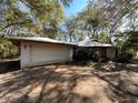 View of the attached garage and front entrance of the home at 2663 Magnolia Rd, Deland, FL 32720