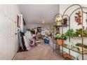 A cluttered living room with boxes, furniture, and plants at 159 Sweetgum Ln, Port Orange, FL 32129