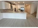 Modern kitchen with stainless steel appliances and an island at 4946 Shady Pines Dr, Saint Cloud, FL 34772
