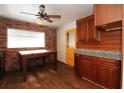 Eat in kitchen features granite countertops and a pop of color with its yellow door at 1040 Santa Anita St, Orlando, FL 32808