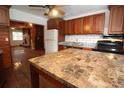 The kitchen showcases wood cabinets, a tile backsplash, and stainless steel appliances at 1040 Santa Anita St, Orlando, FL 32808
