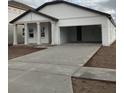 Newly built home with white exterior, attached garage, and a front porch at 5710 Cattle Ranch Dr, Saint Cloud, FL 34771