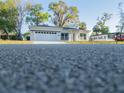 Exterior view of this house with a large two-car garage and inviting front entrance at 765 W Lansdowne Ave, Orange City, FL 32763