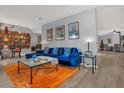 Inviting living room showcasing a stylish blue sofa, modern décor, and a cozy ambiance at 1608 Bomi Cir, Winter Park, FL 32792