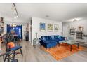 A well decorated living room with unique furniture and an open floor plan at 1608 Bomi Cir, Winter Park, FL 32792