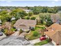 Aerial view of a residential area showing a tan house with brown roof at 2682 Orange Peel Ct, Orlando, FL 32806