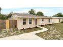 Renovated single story home with a walkway leading to the front porch at 1209 Baranova Rd, Ocoee, FL 34761