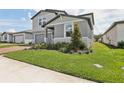 Well-maintained home exterior features a neat lawn and welcoming curb appeal at 2949 Wild Olive Dr, St Cloud, FL 34772