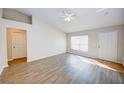 Bright living room with wood-look floors and high ceilings at 441 Danube Dr, Kissimmee, FL 34759