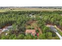 Property surrounded by trees, showing house and lot size at 6900 Sw 137Th Court Rd, Ocala, FL 34481