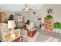 Cozy living room with tile flooring, comfortable seating, and decorative decor at 13256 Whisper Bay Dr, Clermont, FL 34711