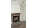 Cozy fireplace with stone surround in living room at 1712 Lake Alden Dr, Apopka, FL 32712