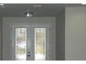 Elegant front door with stained glass accents at 1712 Lake Alden Dr, Apopka, FL 32712