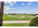 Landscaped golf course with lush greens and fairways at 1364 Centre Court Ridge Dr # 201, Reunion, FL 34747