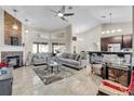 Bright, open living room featuring a stone fireplace, neutral decor, and plenty of seating for entertaining at 8048 Canyon Lake Cir, Orlando, FL 32835