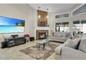 Cozy living room with a stone fireplace, large TV, and comfortable seating, perfect for relaxing at 8048 Canyon Lake Cir, Orlando, FL 32835
