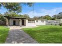 Beautifully landscaped front yard with lush green grass and inviting curb appeal at 133 Pinecrest Dr, Sanford, FL 32773