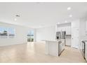 Bright kitchen with white cabinets, stainless steel appliances, and a large island at 2121 Rosewood Dr, Bartow, FL 33830