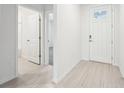 Bright and spacious entryway with tile flooring and access to bathroom and another room at 2125 Rosewood Dr, Bartow, FL 33830