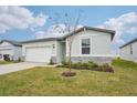 One-story house with stone accents and a two-car garage at 2125 Rosewood Dr, Bartow, FL 33830