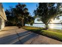 Large patio overlooking lake at sunset at 1704 Ison Ln, Ocoee, FL 34761