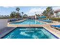 Community pool with spa and lounge chairs at 2007 Disney Mgm Studio Ct, Kissimmee, FL 34746