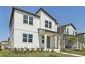 Beautiful two-story home featuring white siding, well-placed windows, and a neatly kept lawn at 2378 Broadbrook Dr, St Cloud, FL 34771
